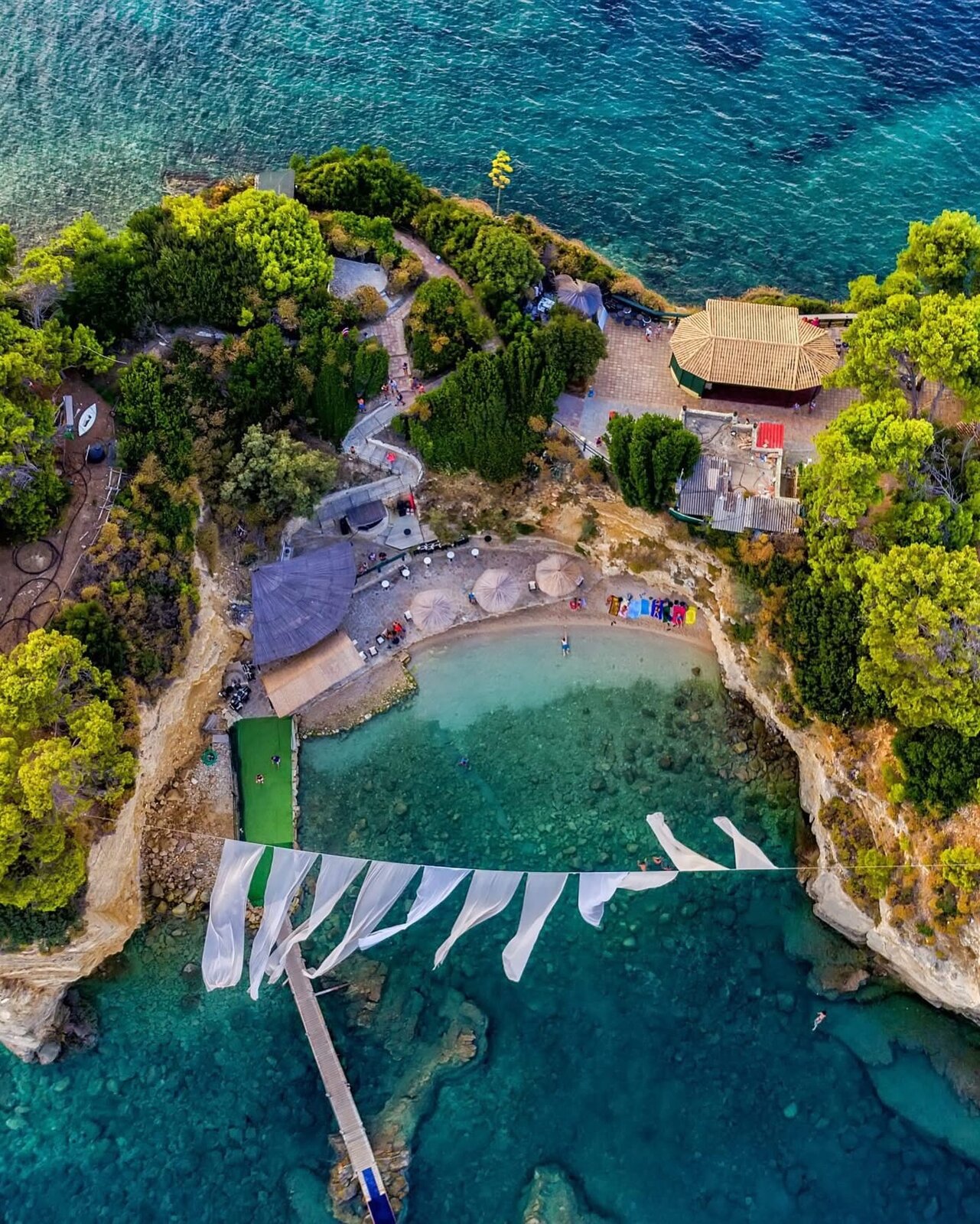 Looking down the wooden boardwalk of the Cameo Island bridge towards the islet