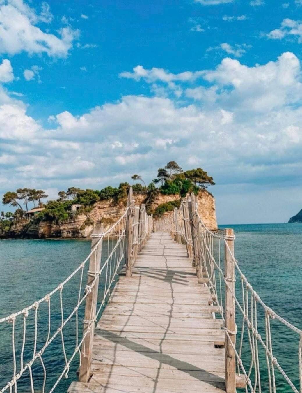 The wooden suspension bridge to Cameo Island on a clear sunny day