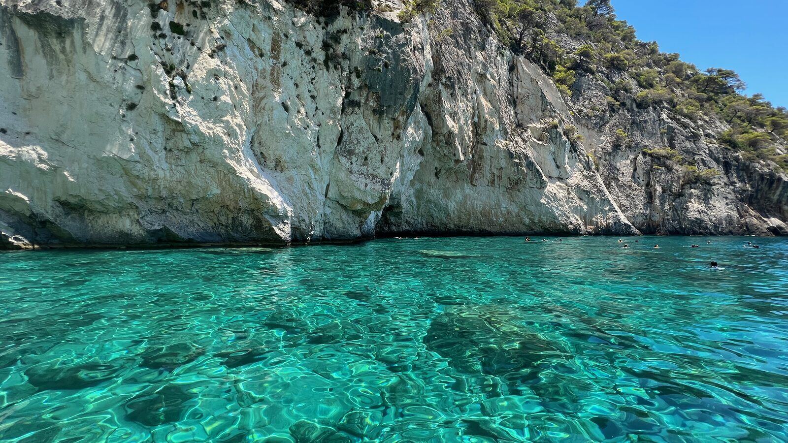 White limestone cliffs and turquoise water at the Keri Caves on the southern coast of Zakynthos