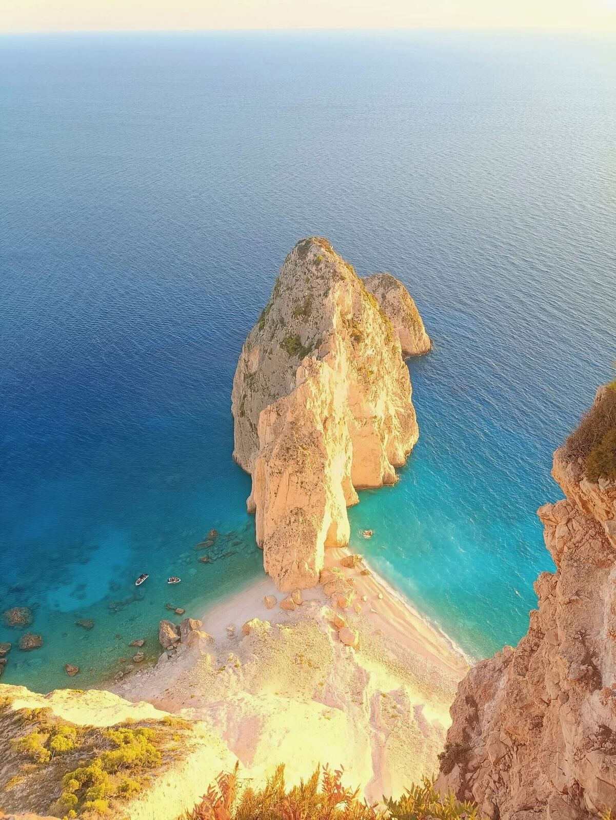 Golden hour view of Myzithres rock and beach from the clifftop