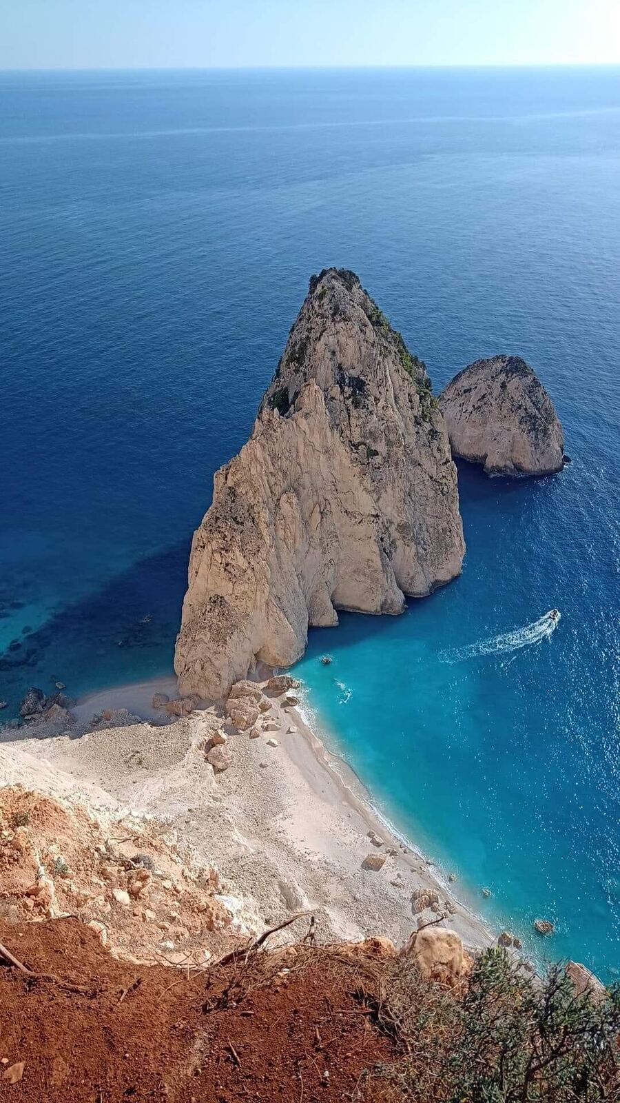 Myzithres rock formation with beach in warm afternoon light