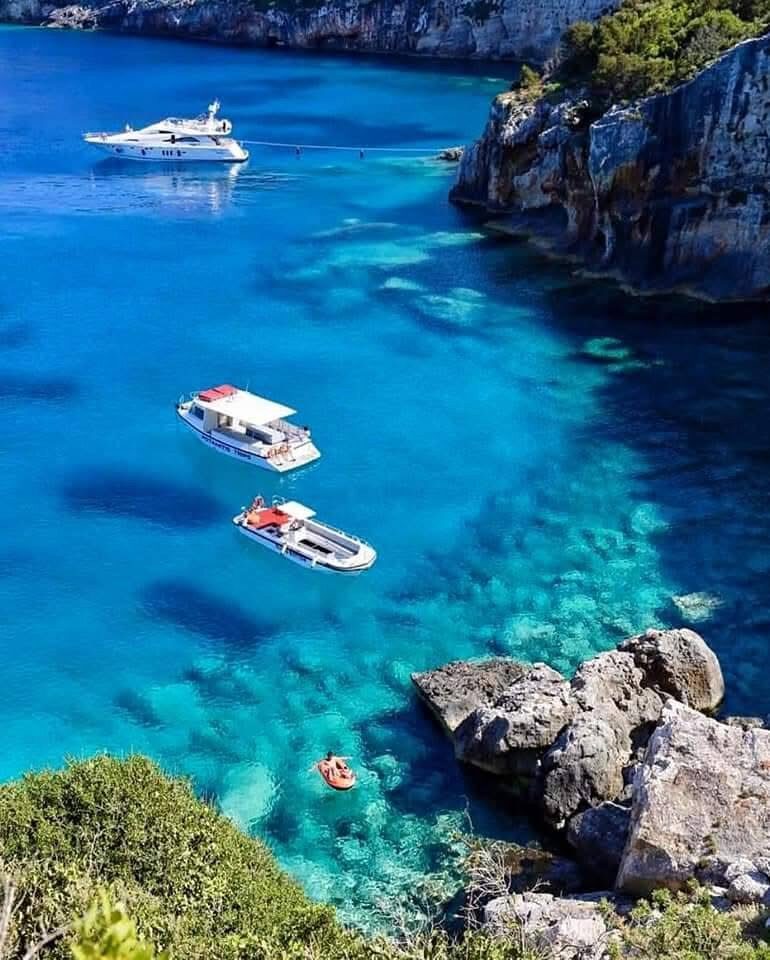 View down the cliffs to the snorkeling area at Potamitis Diving Spot