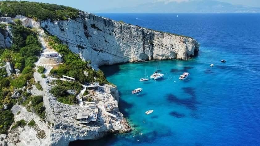 Long stretch of rocky coast and turquoise water at Potamitis Diving Spot