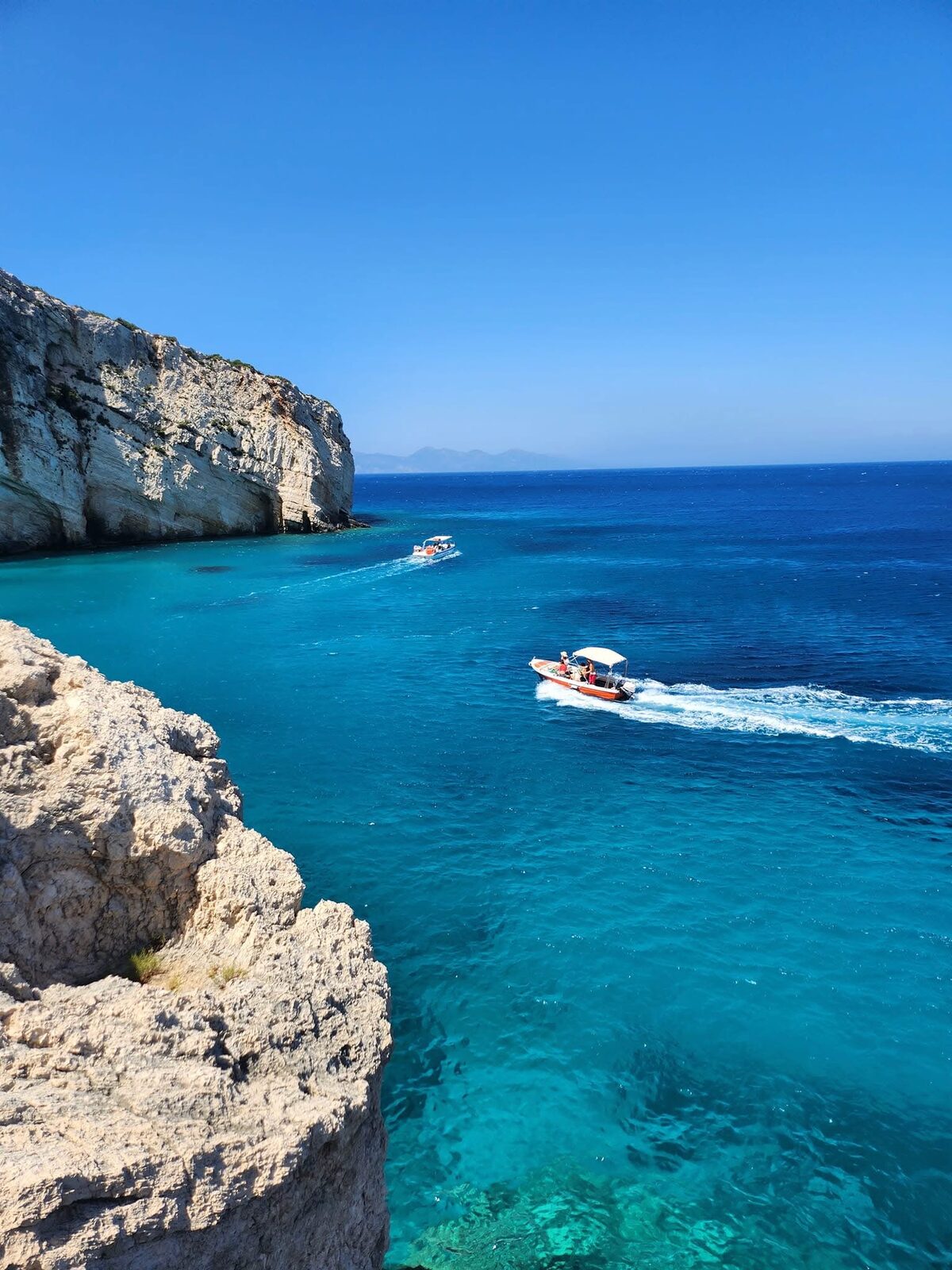White limestone cliffs above the turquoise water at Potamitis