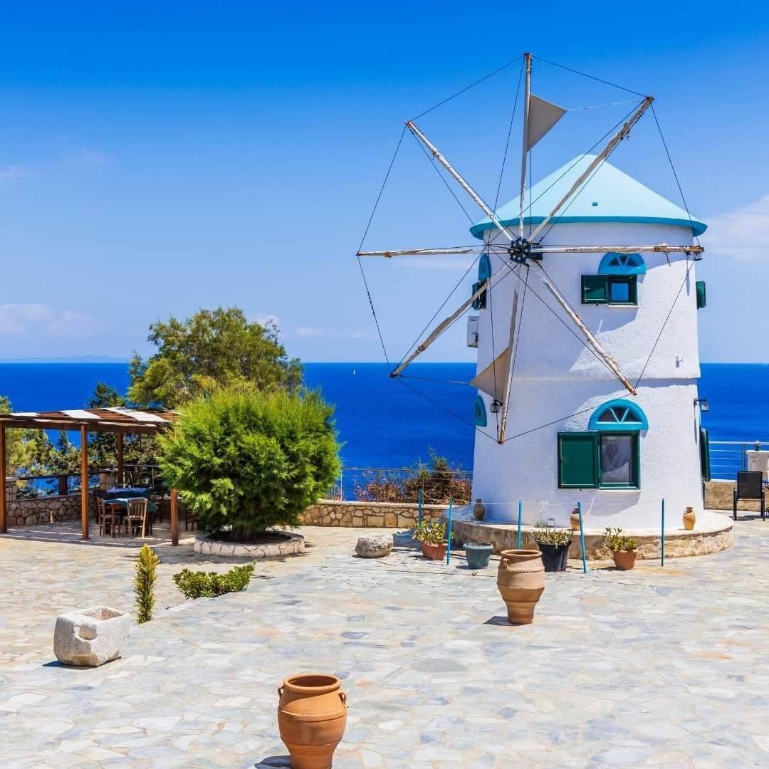 Free sunbeds on the rocky platform overlooking the sea at Potamitis