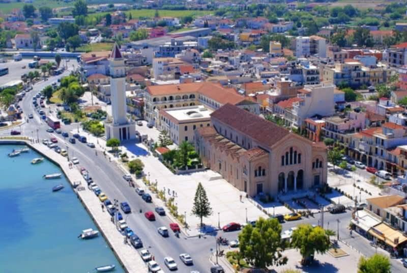 Aerial daytime view of Agios Dionysios church and the waterfront