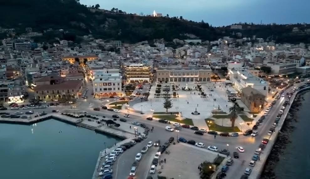 Aerial evening view of Plateia Solomou and the harbour at dusk