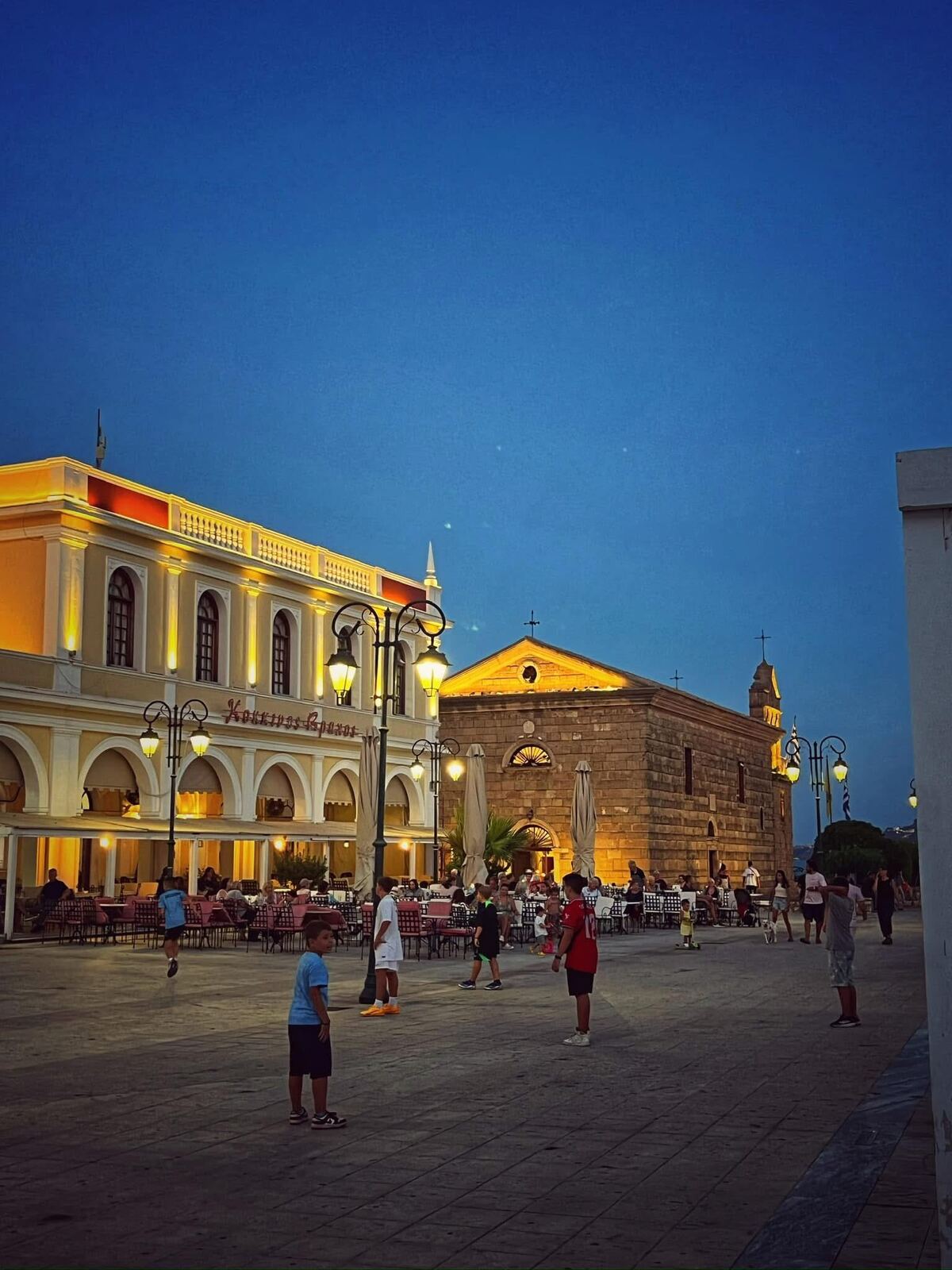 Evening atmosphere at Plateia Solomou with locals and visitors